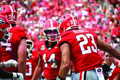 Wesley Branch/The Clayton Tribune. Former Rabun County and current UGA quarterback Gunner Stockton (center) celebrates with teammate Jaden Reddell after the duo connect for a touchdown in Georgia’s 63-3 Sept. 5 win over Tennessee State. Stockton and the Bulldogs will host Western Kentucky on Sept. 12.