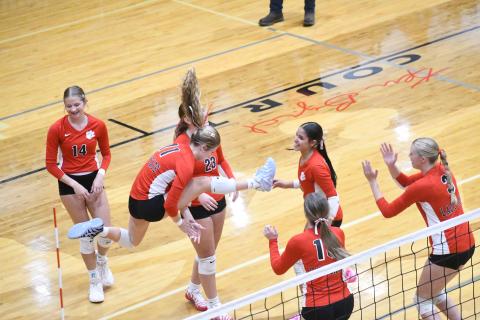 Wesley Branch/The Clayton Tribune. Rabun County volleyball players celebrate during their home match versus East Hall on Sept. 8. The Lady Cats were victorious in the match 2-0, winning by scores of 25-21 and 25-19.