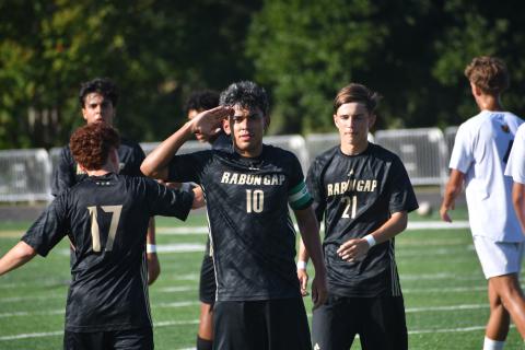 Wesley Branch/The Clayton Tribune.  Rabun Gap senior and captain Jose Luis Carrillo salutes after scoring versus ACA in the Eagles’ 3-0 win over the Lions on Sept. 9. Carillo’s hat trick on Sept. 12 helped lead Rabun Gap past Winston Salem Christian, 5-4.