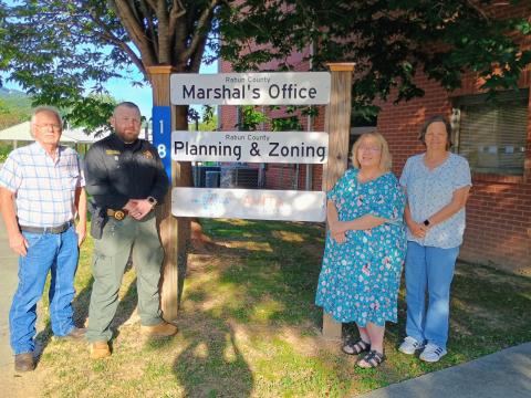 Megan Horn/The Clayton Tribune. The Rabun County Marshal’s Office serves as the code enforcement officer by enforcing county ordinances and state laws. The office is responsible for Planning and Zoning and also oversees county probation officers. Pictured are Planning and Zoning Administrator Tommy York, Rabun County Marshal David Gerrells, Lynne Ramey and Administrative Assistant Lisa Gibson. 
