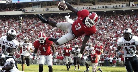 Photo courtesy of DJ Shockley. Former UGA quarterback DJ Shockley goes airborne on a run versus South Carolina during his playing days. Shockley, now a sports anchor with Fox 5 Atlanta, was Georgia’s starter in 2005. 