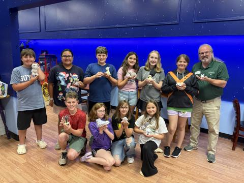 Photo courtesy of Rabun County 4-H. Rabun County 4-H members explored their artistic talents during a summer outing to Celestial Studios in Gainesville on June 16. They are pictured holding their painted pottery. 