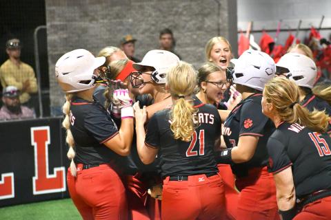 Wesley Branch/The Clayton Tribune. The Rabun County softball team celebrates after a three-run home run by junior River Evans, left, in the sixth inning of the Lady Cats’ 15-10 win over Clarke Central on Oct. 5. Evans’ home run was part of a nine-run sixth inning. With the victory, head coach Jessica Evans collected her 200th career win.