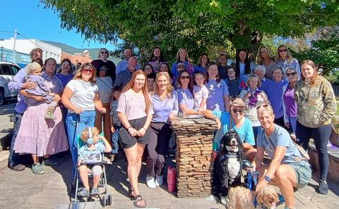 Megan Horn/The Clayton Tribune. Many community members wore purple and walked in solidarity with those who have been affected by domestic violence during a walk on Main Street organized by Fight Abuse In The Home (F.A.I.T.H.) Wednesday, Oct. 7. October is Domestic Violence Awareness Month. 