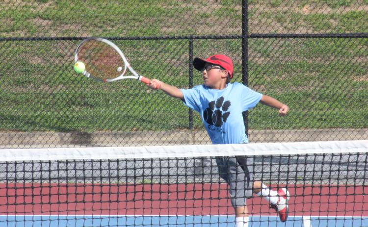 Jack Getty extends to return a ball during a singles match at Rabun County High School’s tennis courts in Tiger on Tuesday. (Photo by Glendon Poe/The Clayton Tribune)