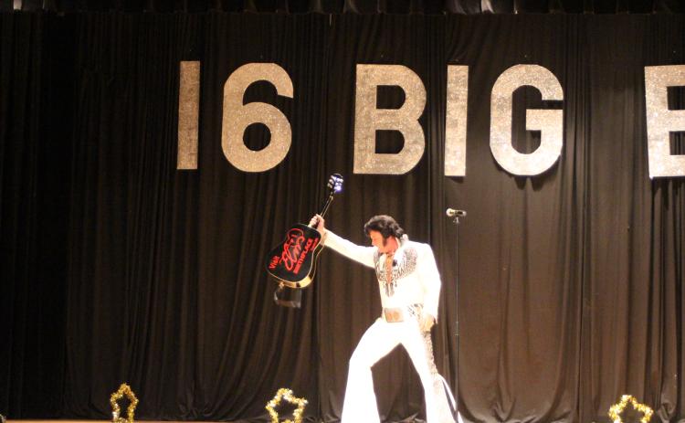 Megan Broome/The Clayton Tribune. World Champion Elvis Tribute Artist David Lee entertains a crowd of Elvis fans who attended a concert on the weekend of the 2019 Big E Festival and Elvis Tribute Artists Competition by singing, dancing and showing off his guitar.