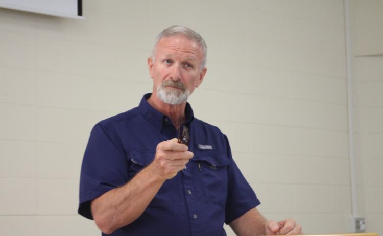 Megan Broome/The Clayton Tribune. Roger Fitzpatrick, site administrator at the Rabun County location of Mountain Education Charter High School, speaks to faculty and staff members for the Rabun County site as well as administrators from the central office and other regions at a celebration event at the Mountain Education Charter High School location in Tiger Monday.