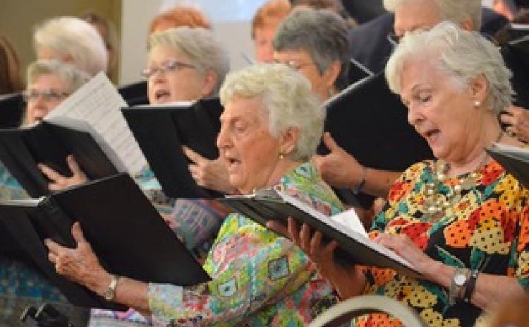 Wayne Knuckles/The Clayton Tribune. Kathleen Arbitter and Linda Brandsma join the rest of the choir in song as Clayton Baptist Church celebrated their 200th anniversary Sunday.
