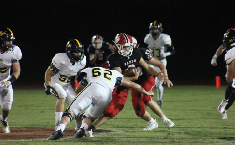 North Murray defensive lineman Hayden Jones (62) attempts to tackle Rabun County linebacker AJ Wheeler (3) after an interception during the second half at Frank Snyder Memorial Stadium in Tiger on Aug. 30. (Glendon Poe/The Clayton Tribune)