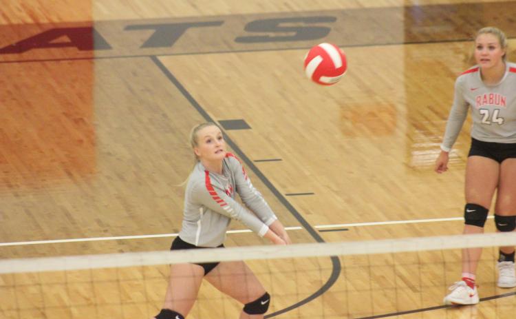 Rabun County’s Ali Ramey, left, digs at a ball, while teammate Beth Payne looks on during a match against Cherokee Bluff at Rabun County’s Ken Byrd Court in Tiger last Thursday. (Glendon Poe/The Clayton Tribune)