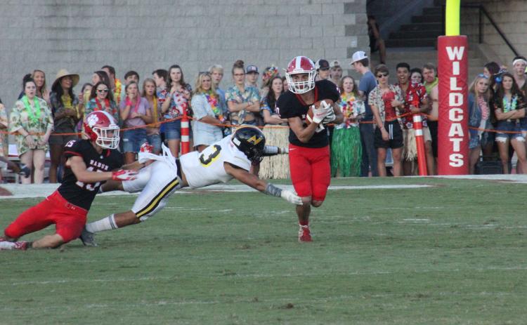 Rabun County wide receiver Sam Adams, left, blocks a North Murray defender, while teammate Sutton Jones, right, runs for additional yards during the first half at Frank Snyder Memorial Stadium in Tiger last Friday night. (Glendon Poe/The Clayton Tribune)