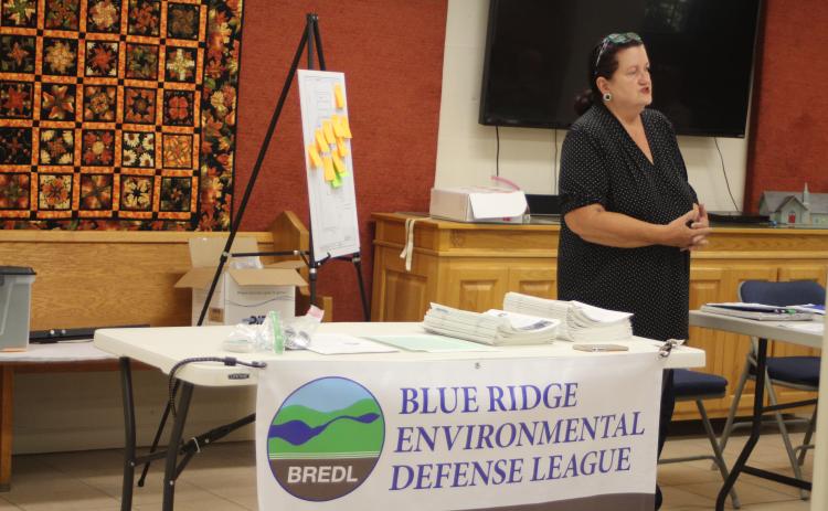 Megan Broome/The Clayton Tribune. Cherie Faircloth, founding member of the Rabun Gap Chapter of the Blue Ridge Environmental Defense League (BREDL), speaks at community discussion she organized addressing “What’s in your water?” at St. James Episcopal Church Sept. 25. The goal of the discussion was to spark community interest and action about concerns of chemicals in the drinking water supply and how they are tested for.