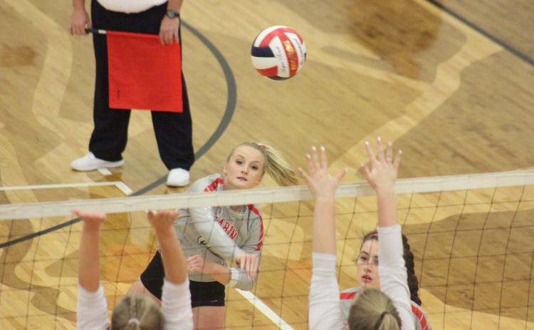 Rabun County’s Ali Ramey, top left, spikes the ball against Dade County during the quarterfinal round of the GHSA Class A/AA-Public state playoffs at Ken Byrd Court in Tiger last Saturday afternoon. (Glendon Poe/The Clayton Tribune)