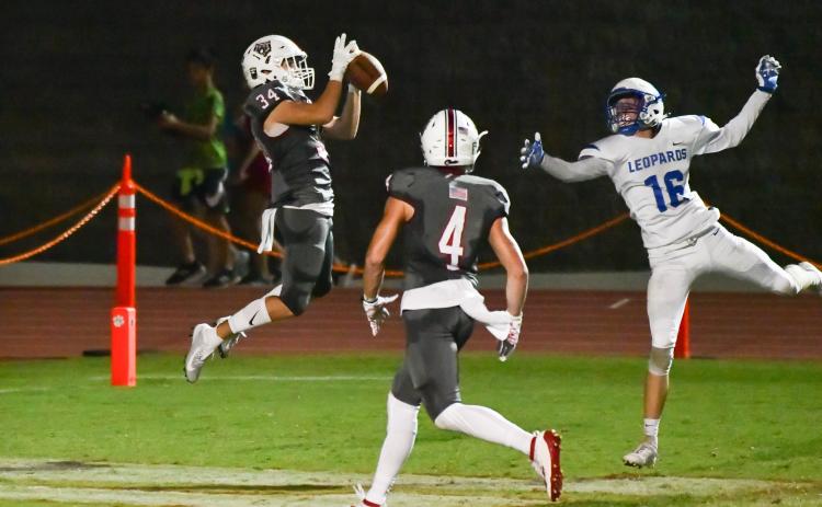 Rabun County wide receiver Tate Ramey (34) catches a pass while teammate Braxton Hicks watches during a game against Banks County at Frank Snyder Memorial Stadium in Tiger on Oct. 4. (Scott Poss/Special to The Tribune)