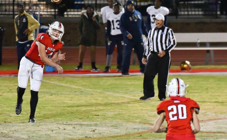 Gunner Stockton completes a pass to Sutton Jones against B.E.S.T. Academy Friday night.