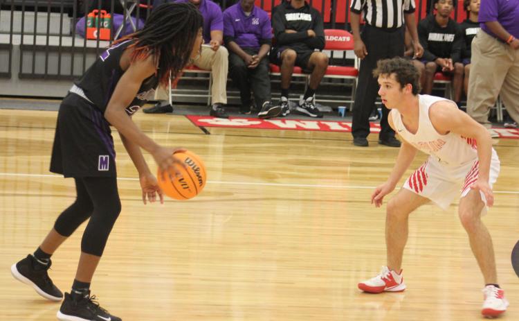 Andy Diffenderfer/The Clayton Tribune. Sam Adams defends Monticello’s M.J. Stone in the Wildcats’ Region 8-AA home victory last Saturday.