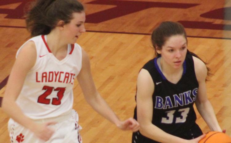 Andy Diffenderfer/The Clayton Tribune Rabun County's Gracie Deetz shadows Hailey Seahorn of Banks County in a Region 8-AA semifinal.