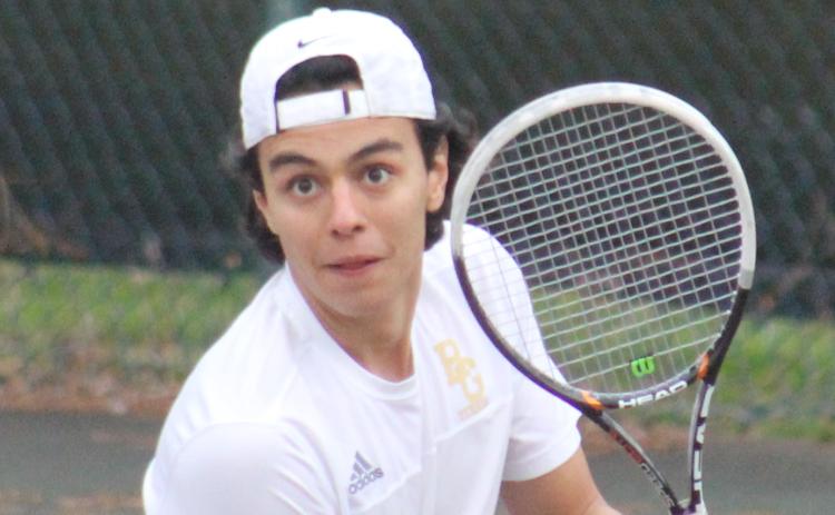 Andy Diffenderfer/The Clayton Tribune Jacobo Saenz prepares to wallop a backhand.