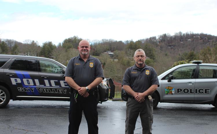 Megan Broome/The Clayton Tribune Sky Valley Chief of Police Vaughn Estes, left, and Lt. David Edwards stand in front of their police vehicles to show the new car the department is getting after council members approved the purchase of a 2020 Dodge Durango and Ram 1500. Shown on the right is one of the Subarus the police officers are currently driving.