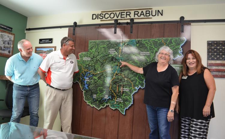 Wayne Knuckles/The Clayton Tribune. Rabun Chamber of Commerce President Juanita Shope has been hired by the county as a Business Development and Marketing Specialist. Meeting to discuss the appointment at the new Welcome Center on Highway 441 are, from left, Rick Story, executive director of the Development Authority of Rabun County, Claude Dillard, Development Authority board chairman and Dillard City Council member, Shope and Irene Bynum Faith, chairman of the Rabun County Chamber of Commerce.