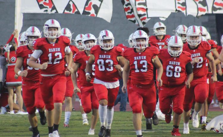 Andy Diffenderfer/The Clayton Tribune. The Wildcats charge onto the field for last Friday’s game with Jefferson at Frank Snyder Memorial Stadium
