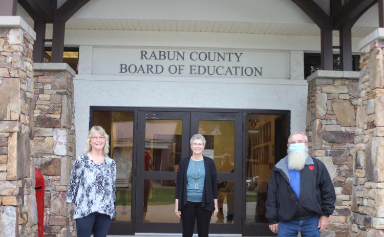 Megan Broome/The Clayton Tribune. Retirees of Rabun County Schools, Judy Burch, 14 years, Becky Cross, 25 years, and Pop Wilburn, 13 years, were recognized at the September Board of Education meeting.