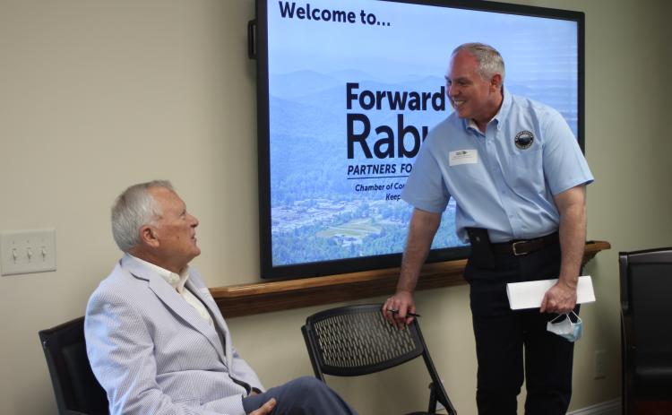 Megan Broome/The Clayton Tribune. Former Gov. Nathan Deal (left) is greeted by Forward Rabun Director Rick Story Tuesday at the organization's inaugural board meeting. Story previously worked for Deal during his time as Georgia governor.