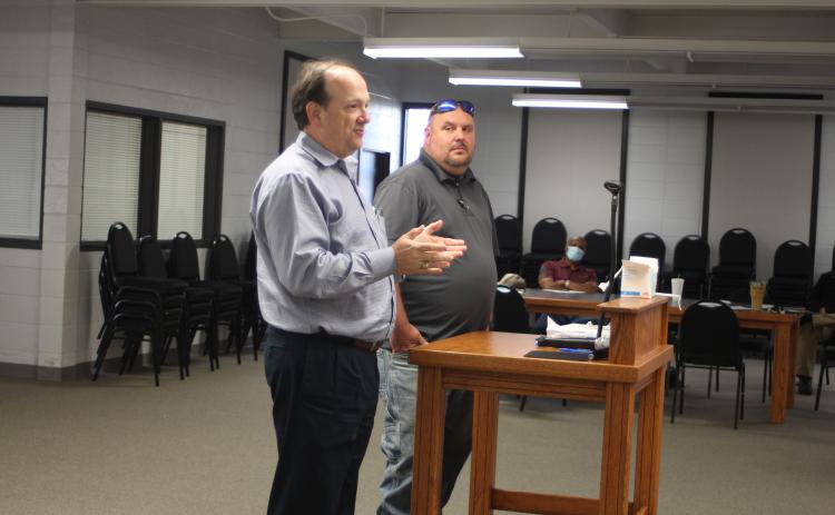 Megan Broome/The Clayton Tribune. Eric Neese, of the engineering company Freese and Nichols, Inc., and Public Works Director Jason Walroup address Clayton council members Tuesday and give an update on the GDOT project to widen Highway 441.