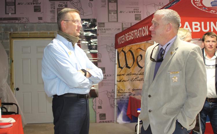 Megan Broome/The Clayton Tribune. Rep. Doug Collins talks with Sheriff Chad Nichols at a meet-and-greet held at the Rabun County Republican Party headquarters last Saturday. Collins is vying for a United States Senate seat and Nichols is running for reelection.