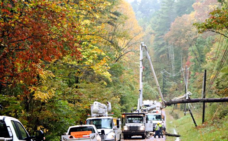 Photo courtesy Liza Broz. Georgia Power works at an address on Old 441 by the Short Line last Saturday to restore power and clear the roadway after heavy storms from Hurricane Delta knocked over trees onto power lines.