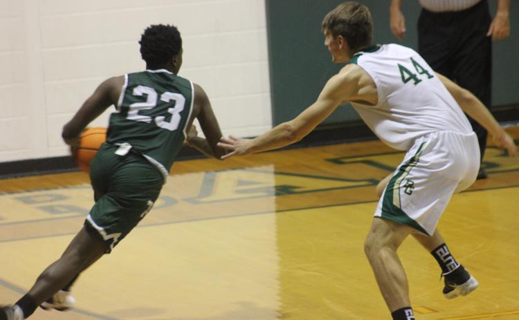 Andy Diffenderfer/The Clayton Tribune Devonte Allen of Tallulah Falls tries to drive on Rabun Gap’s Zsombor Vertes.