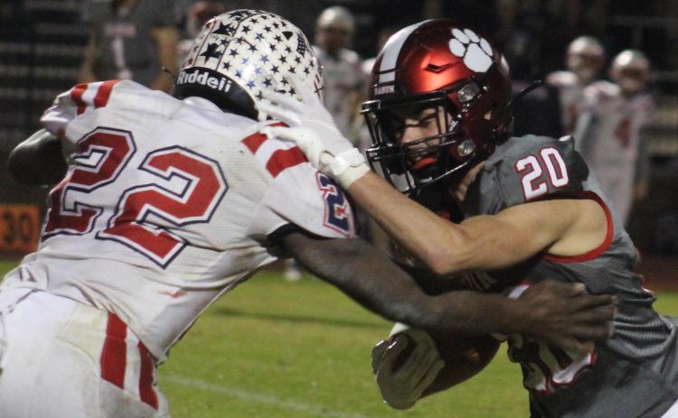 Andy Diffenderfer/The Clayton Tribune Rabun County receiver Sutton Jones battles for more yardage against Haralson County’s Marc Harris.