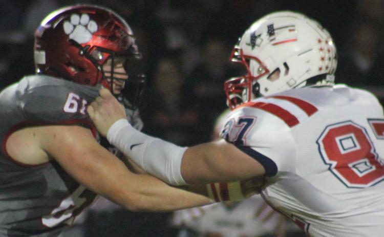 Andy Diffenderfer/The Clayton Tribune Wildcat lineman Will McCraw tangles with Haralson County’s Riley Bell in last Saturday’s Class AA first-round playoff at Frank Snyder Memorial Stadium.