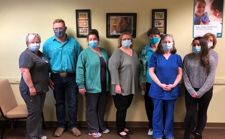 Photo courtesy Rabun County 4-H Club. Rabun County 4-H President Carson Carpenter with members of the Rabun County Health Department.