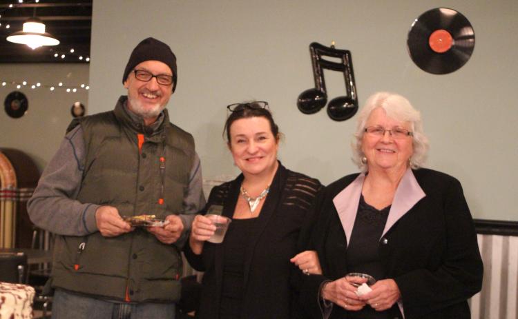 Megan Broome/The Clayton Tribune. Dr. Guy Gober, left, Irene Bynum Faith and Juanita Shope attend a reception honoring Shope last Thursday at The Diner below the Rabun County Civic Center. Shope recently stepped down as president and community liaison of the Rabun County Chamber of Commerce.