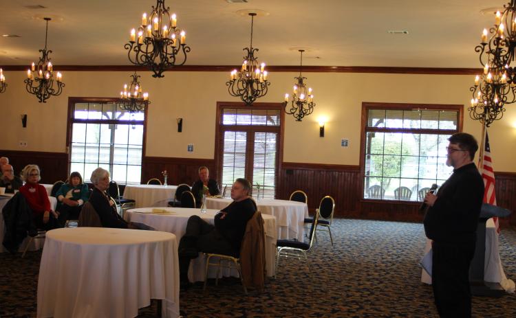 Megan Broome/The Clayton Tribune. The Rabun County Republicans hosted guest speaker Mike Seigle at their March Republican Party meeting held at The Dillard House Conference Center Saturday. Rabun Republican Party members Connie Holcomb, back left, Linda Burns and President Sam Burns hear remarks from Seigle about election demographics and marketing strategies for the party.