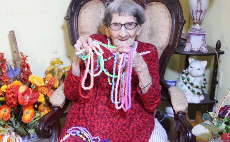 Megan Broome/The Clayton Tribune. Althalene Waters spends her days making necklaces and bracelets out of beads and finds pleasure in gifting them to everyone she meets. She was born on March 20, 1920 and turns 101 on Saturday.