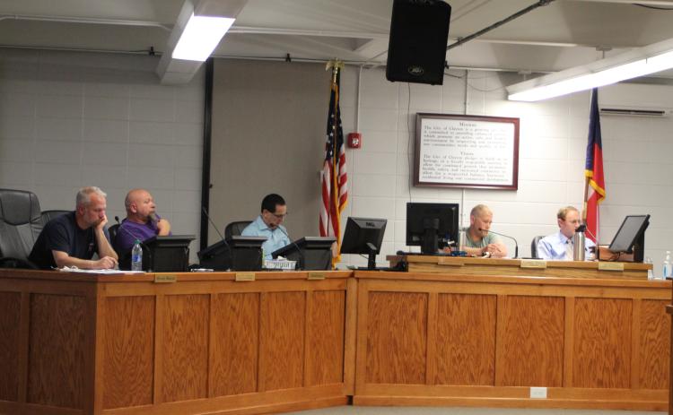 Megan Broome/The Clayton Tribune. Clayton City Council members discuss rezoning the library and other city business at last week's city council work session.