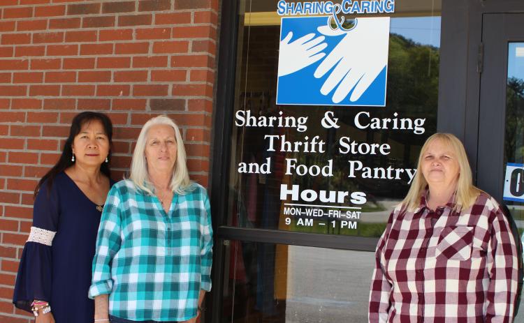 Megan Broome/The Clayton Tribune. Monthian Phillips, vice president of Rabun County Sharing and Caring, left, Gail Whitmire, food pantry manager and Linda Giles, president, are volunteers at Rabun County Sharing and Caring. The nonprofit recently moved locations to Plaza Way in Clayton after being located on Hiawassee St. since 1999.