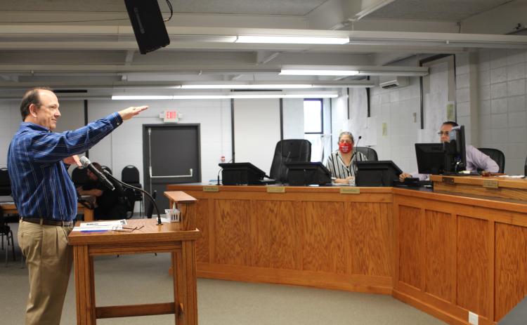 Megan Broome/The Clayton Tribune. Eric Nease, engineer for the city of Clayton, addresses council members about fixing a slope on Shadyside Dr. that resulted from damage sustained in the storm back in late March, at Tuesday’s city council meeting. Nease said that the slope has started endangering the road infrastructure and should be fixed immediately. City officials will vote on an emergency declaration next week to speed-up the repair process.