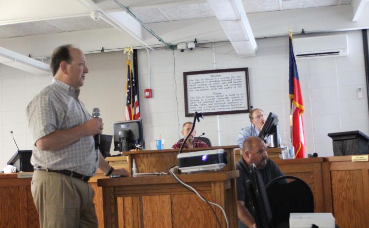 Megan Broome/The Clayton Tribune. Eric Neese, engineer for the city of Clayton, gives a presentation to Clayton council members at Tuesday’s meeting to discuss discrepancies in the billing cycle when the RCWSA billed the city twice in their April water bill. The city initially received an April bill of $85,000 and shortly after received a bill for April for an additional $26,000.