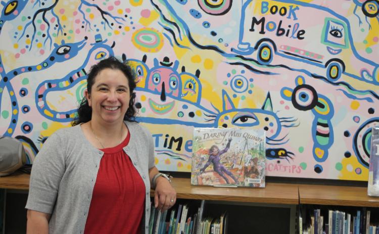 Megan Broome/The Clayton Tribune. Dyana Costello Banks is the new Library Manager at the Rabun County Public Library. Her first day was May 24. She said her mission is to be hands-on with patrons and interact with them as they browse for books to maximize a positive experience at the library.