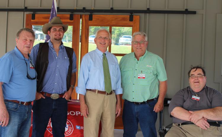 Megan Broome/The Clayton Tribune. Sam Burns, left, T.J. Dearman, chairman of the Jackson County Republican party, Gary Black, current Georgia Agriculture Commissioner, Ed Fickey, chairman of the Rabun County Republican Party, and Ed Henderson, secretary of the Rabun County Republican Party, attend the party’s ice cream social on Monday.