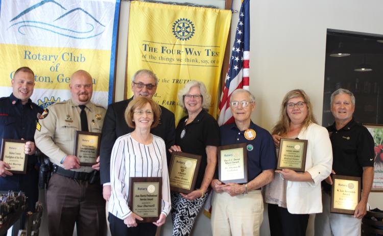 John Murray is Firefighter of the year, left, Sgt. Riley Owens is Officer of the year, Rotary Club of Clayton President Wayne Knuckles, Sue Darnell receives the Jean Harris Professional Award, Jane Janes receives the Gold R. Award, Dr. Tom Callahan receives the J.C. Dover Wheel Award, Rachel Cowart, chief nursing officer for Mountain Lakes Medical Center, receives the Wheel Award on behalf of Mountain Lakes Medical Center, and Tim Ranney receives the W. Lee Arrendale Award.