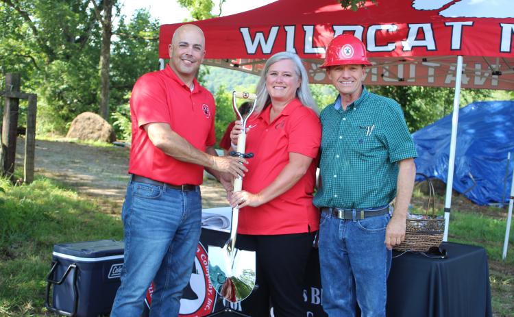 Megan Broome/The Clayton Tribune. Rod Nix from Charles Black Construction, left, hands Rabun County Schools Superintendent April Childers and BOE Chairman Steve Cabe the groundbreaking shovel at the event last Thursday. It marked the start of construction for the RCHS $7 million Agricenter. Charles Black Construction won the bid for the project. The 31 acres of land will be the future home of the Rabun County Future Farmers of America (FFA).