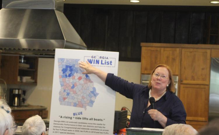 Megan Broome/The Clayton Tribune. Rabun County Democrats hosted guest speaker Melita Easters, executive director and founding chair of the Georgia WIN list, at their monthly meeting held at the Food Bank of Northeast Georgia on Monday. Easters uses charts and maps to discuss and illustrate Georgia’s history of partisan party shifts in districts on a county-by-county basis from 2016 to 2020.