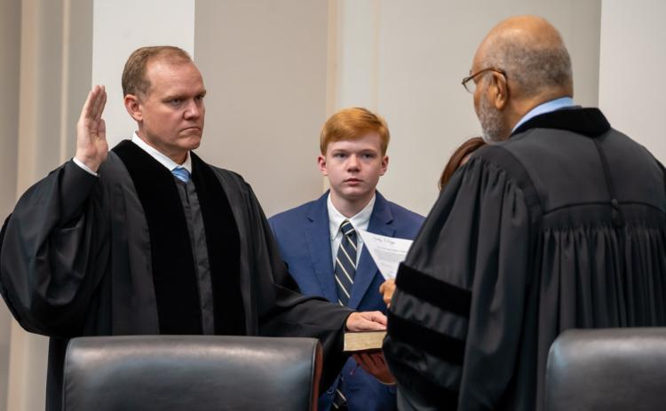 Photo from Court of Appeals SmugMug. Judge Brian M. Rickman is sworn in as Chief Judge of the Court of Appeals of Georgia by Judge Herbert E. Phipps, who is also on the Court of Appeals. The ceremony took place on June 24 in the courtroom of the Nathan Deal Judicial Building.