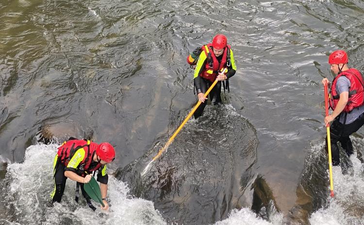Submitted photo. Will McCracken, Isaac Williams and Tate Nichols are part of the swiftwater rescue team with Rabun County Search and Rescue. Rescuers say that speciality training they received in Texas gave them the skills they needed to navigate through the strong current and locate a missing person on the Tallulah River in June.