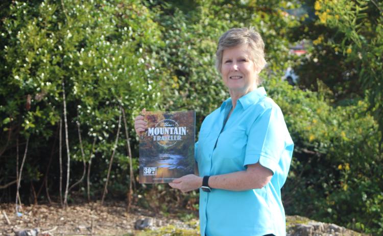 Photo/Megan Broome/The Clayton Tribune. Melissa Elzey of Clayton won $100 for her photo of autumn leaves reflecting on the Tallulah River. Elzey's photo will be featured on the fall edition of The Mountain Traveler magazine, on newsstands now.