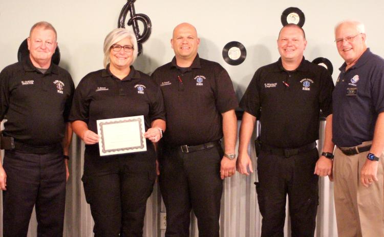 Megan Broome/The Clayton Tribune. Lieutenant Tammy Jones (second from left) is presented with the Rotary Club of Clayton EMS Person of the Year Award at an Oct. 28 Rotary meeting. Also pictured are Mike Carnes, EMS/911 director; Lieutenant Brain Panell (center); Captain Trampes Stancil; and Jef Fincher, Rotary Club of Clayton president.